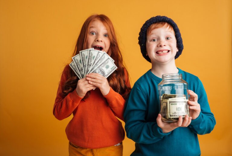 excited-little-redhead-children-holding-money